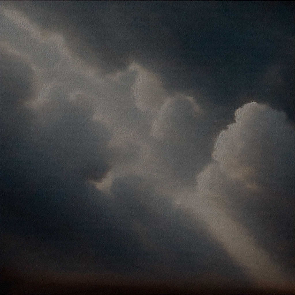 Dramatic stormy clouds with a ray of light breaking through.